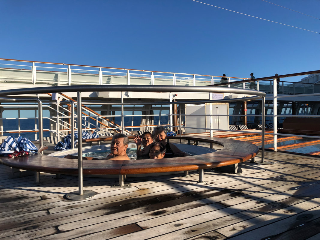 An image of Uncle Pitter (Grandfather/Father), Aunty Petrisia (Grandmother/Mother), Mie Mie (Grandmother/Mother) and her mother Julia (Great Grandmother/Grandmother/Popo/Mother) relaxing in a spa on the deck of a cruise taken in May 2019